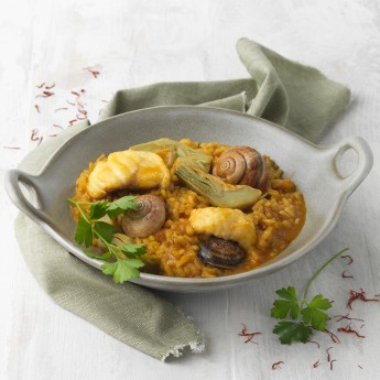 Arroz meloso de rape, alcachofas y caracoles